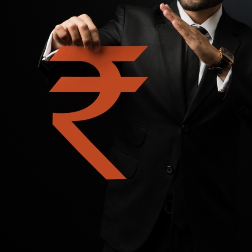 a man in a suit holding a red rupee sign